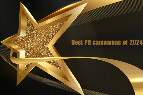 A computer generated image a three dimensional gold star on a black background. Viewed on an angle it has a thick gold outline. There inside of the star contains gold specs